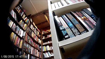 Upskirt teen in bookstore